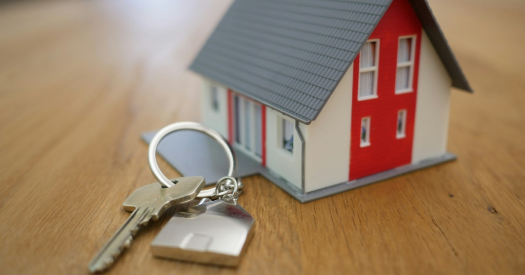 Model house with keys on table