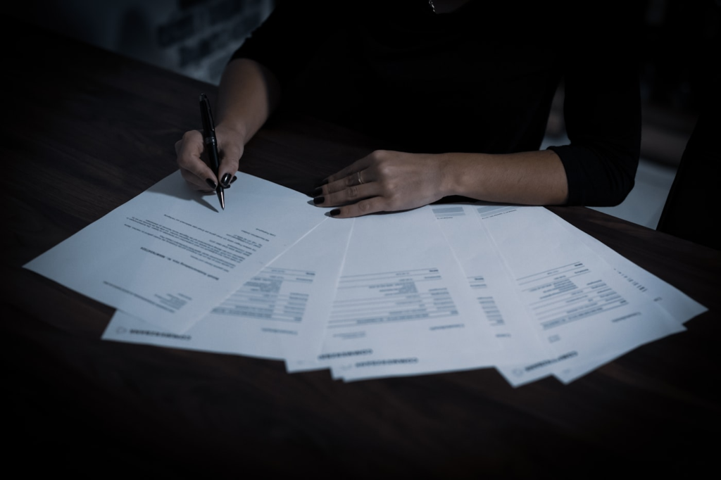 Reviewing tax documents and CRA correspondence at a desk in the Greater Toronto Area