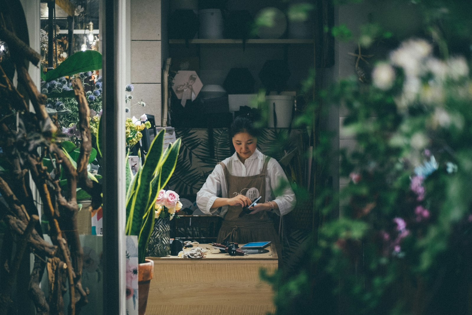Florist and small business owner in Markham at her work table