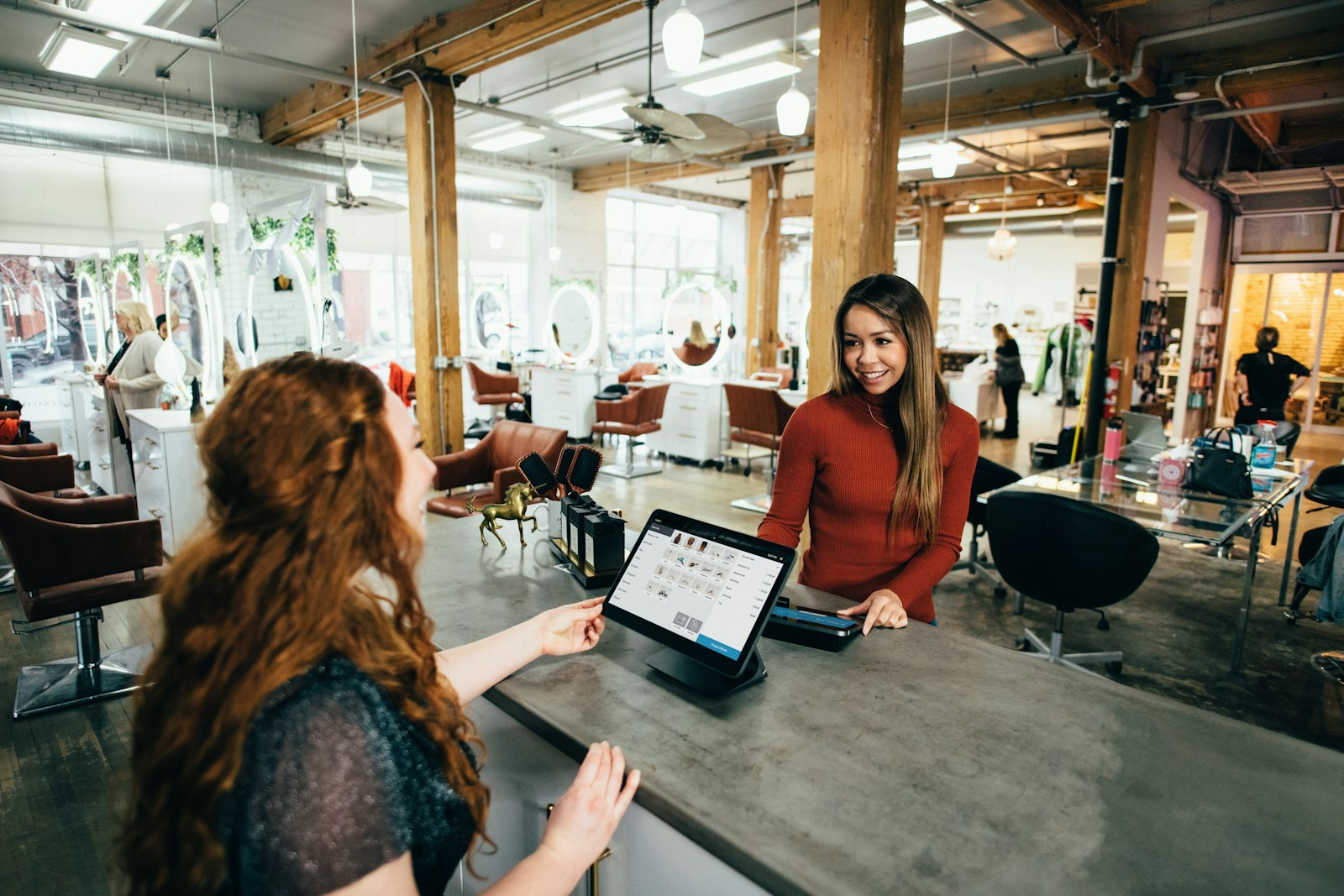 Small business owner in Toronto taking a card payment from a customer